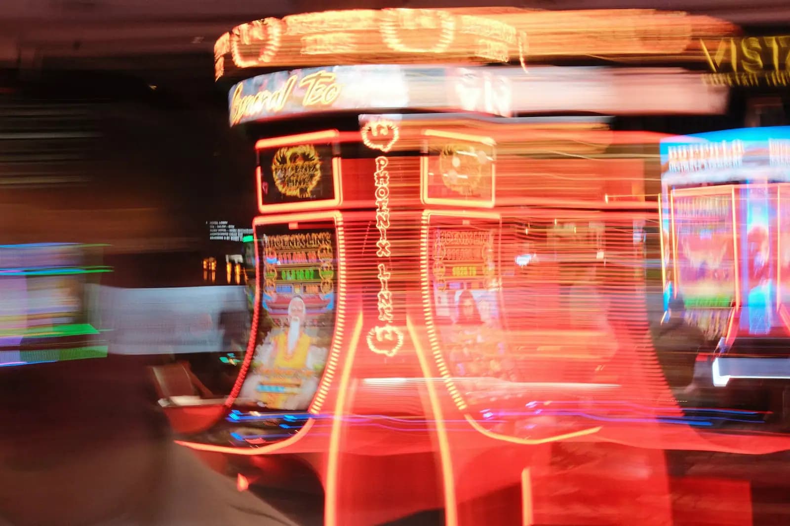 A motion-blurred casino floor with rows of lit slot machines